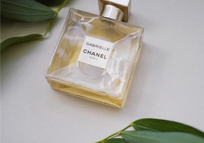 product image of perfume with leaves